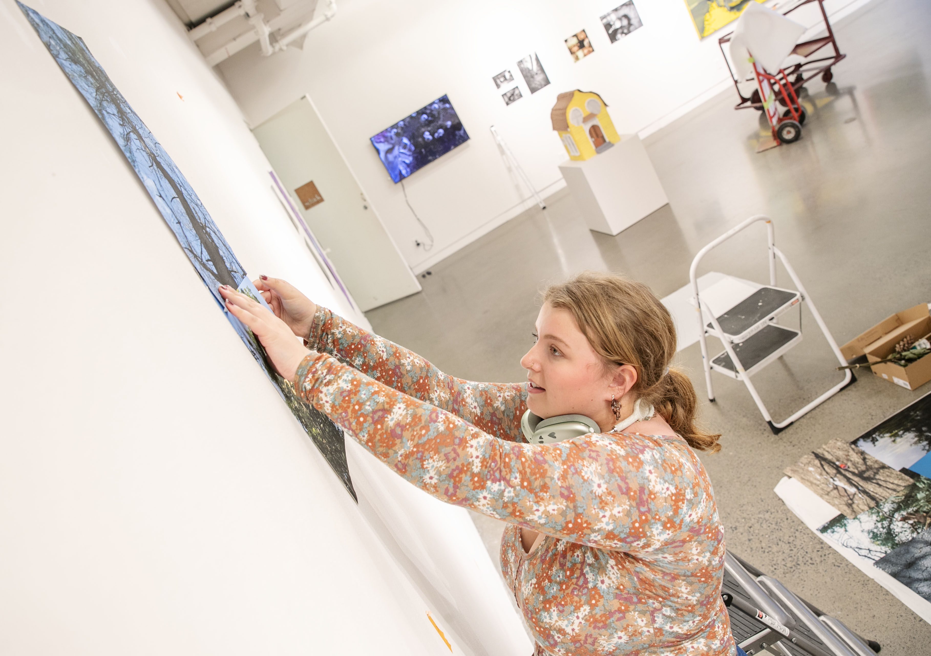 installs artwork for the Juniors’ Show, which is held in conjunction with academic festival.