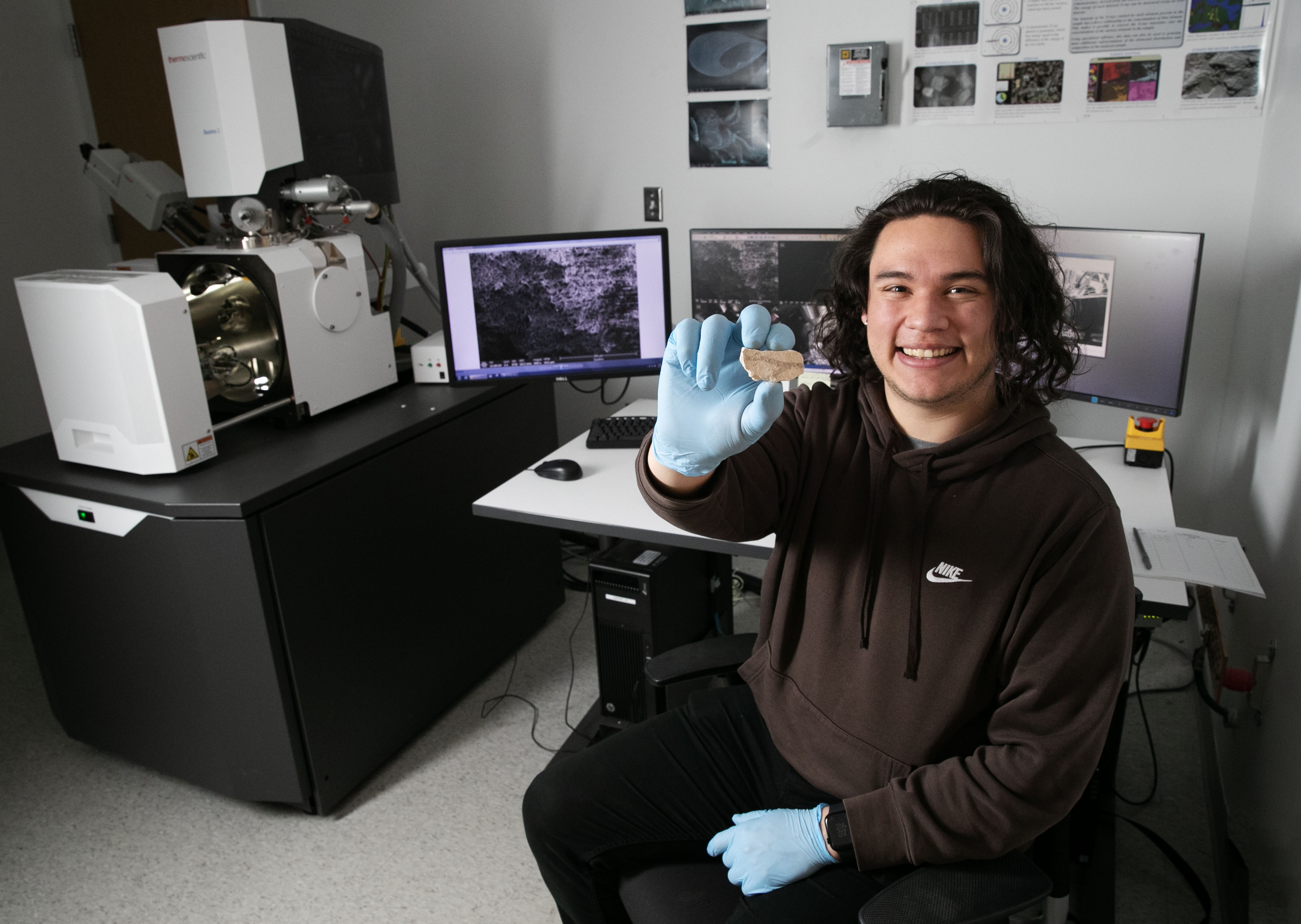 Leo Parra ’24 holds a sample that he is analyzing in the Billie Tisch Center for Integrated Sciences.