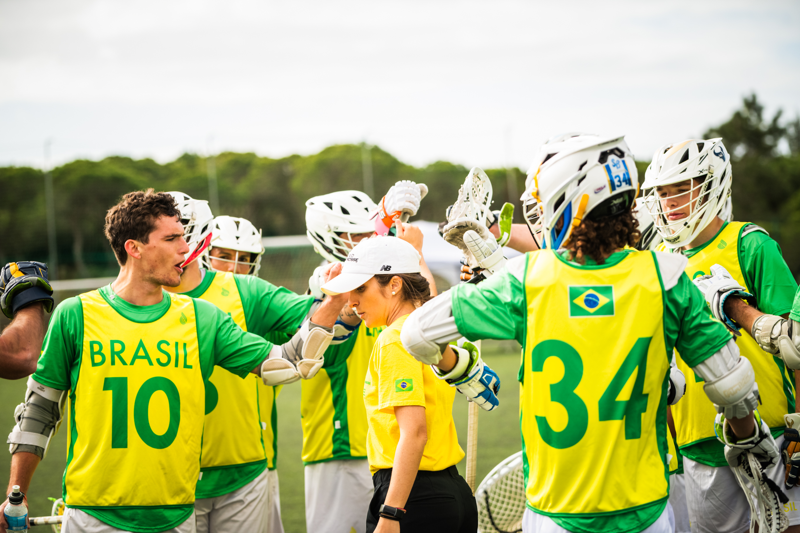 Cristina Velez ’12 shares a moment with the team. (Photo: Brazil Lacrosse)