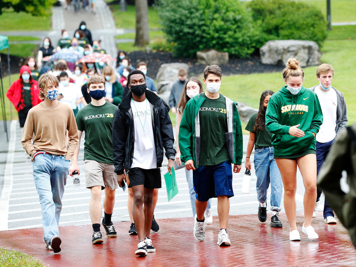 Members of the Class of 2025 walk to New Student Convocation in fall 2021 while COVID-19 precautions remained in effect.