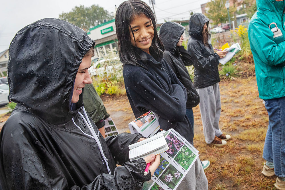 Students smile in the rain 
